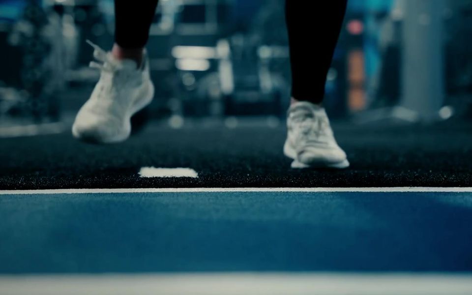 Athlete planting a foot on the turf to change direction