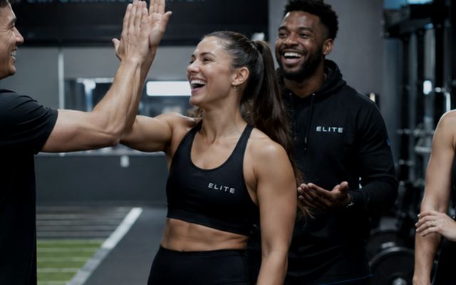 Coworkers high-fiving after a training session
