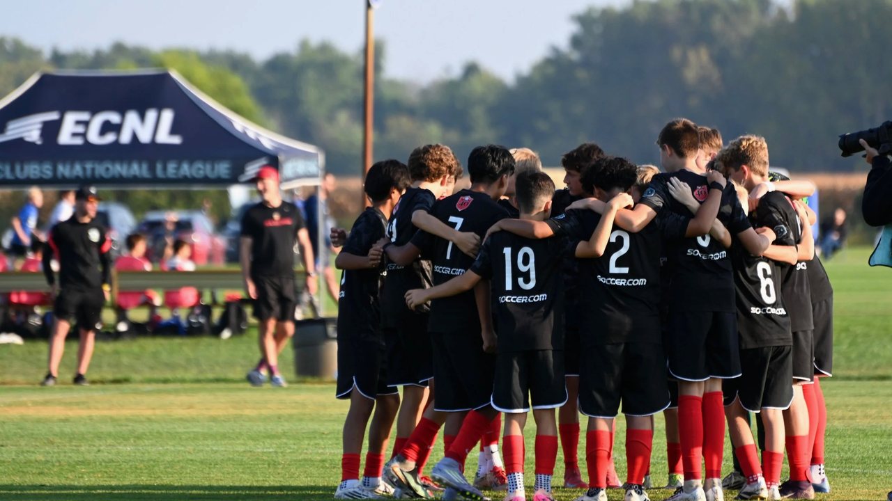 REAL Colorado boys team huddle before a match